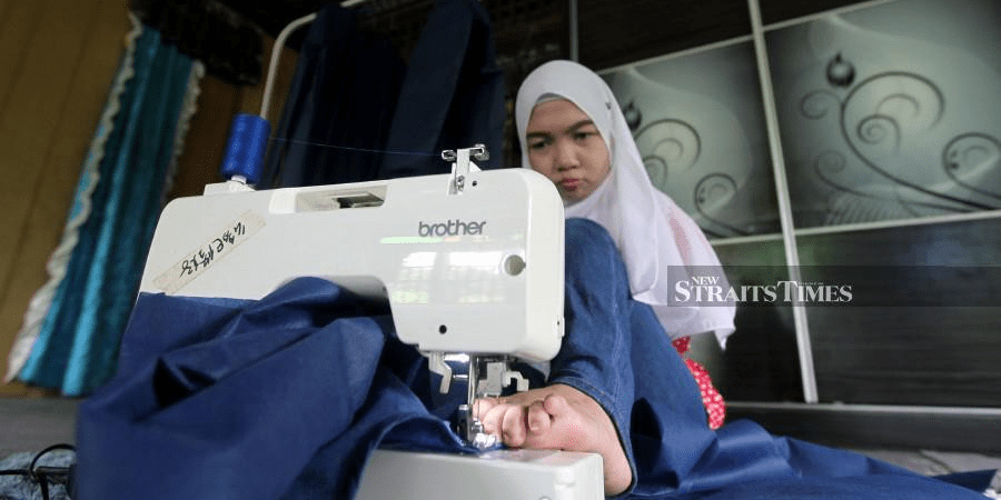 Inspiring Woman who was Born without Arms Uses her Feet to Sew PPE for Frontliners